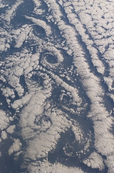 Photograph of vortexes in clouds, taken by an astronaut in space